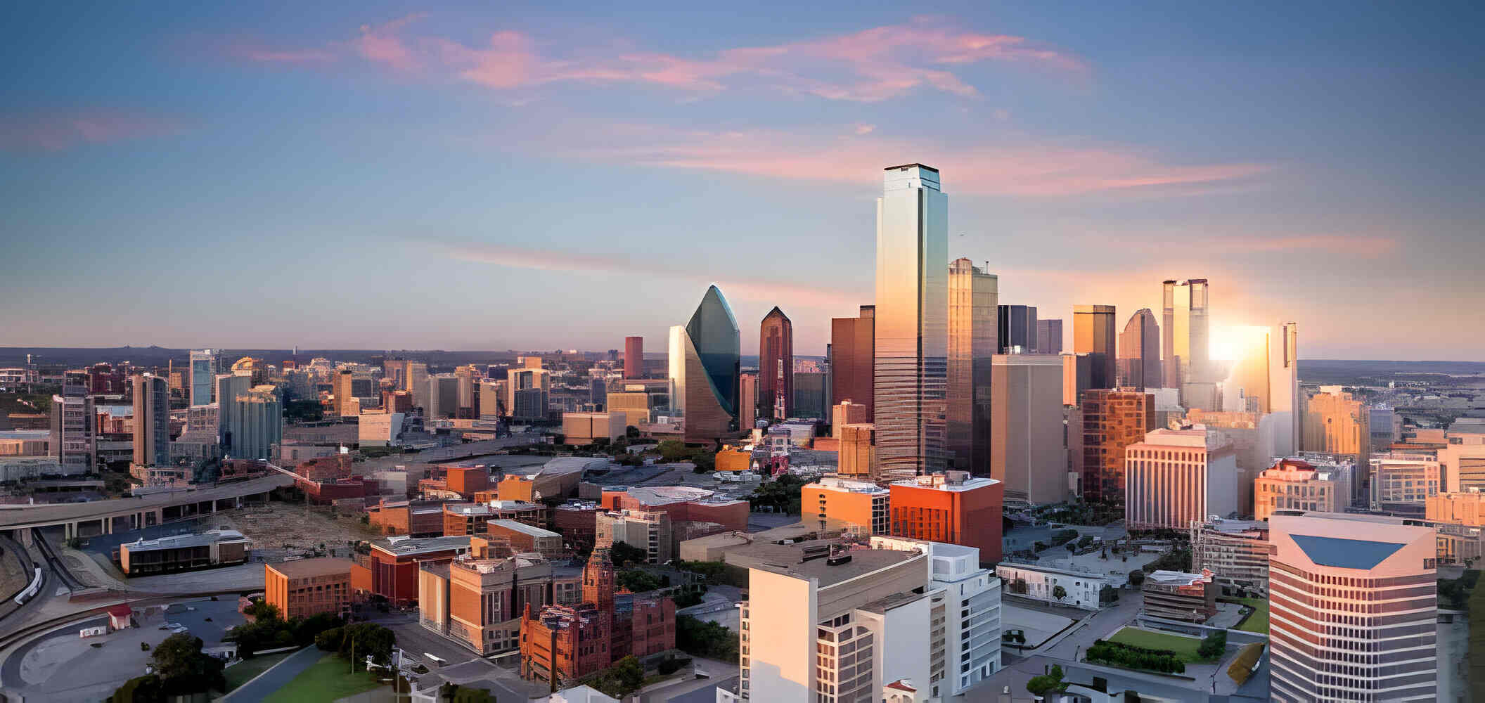 Dallas, Texas cityscape with blue sky at sunset,