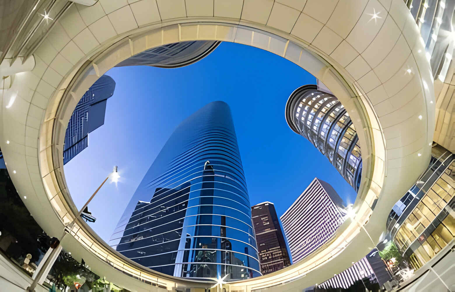 Look up view of Houston Downtown modern skyscrapers at blue hour