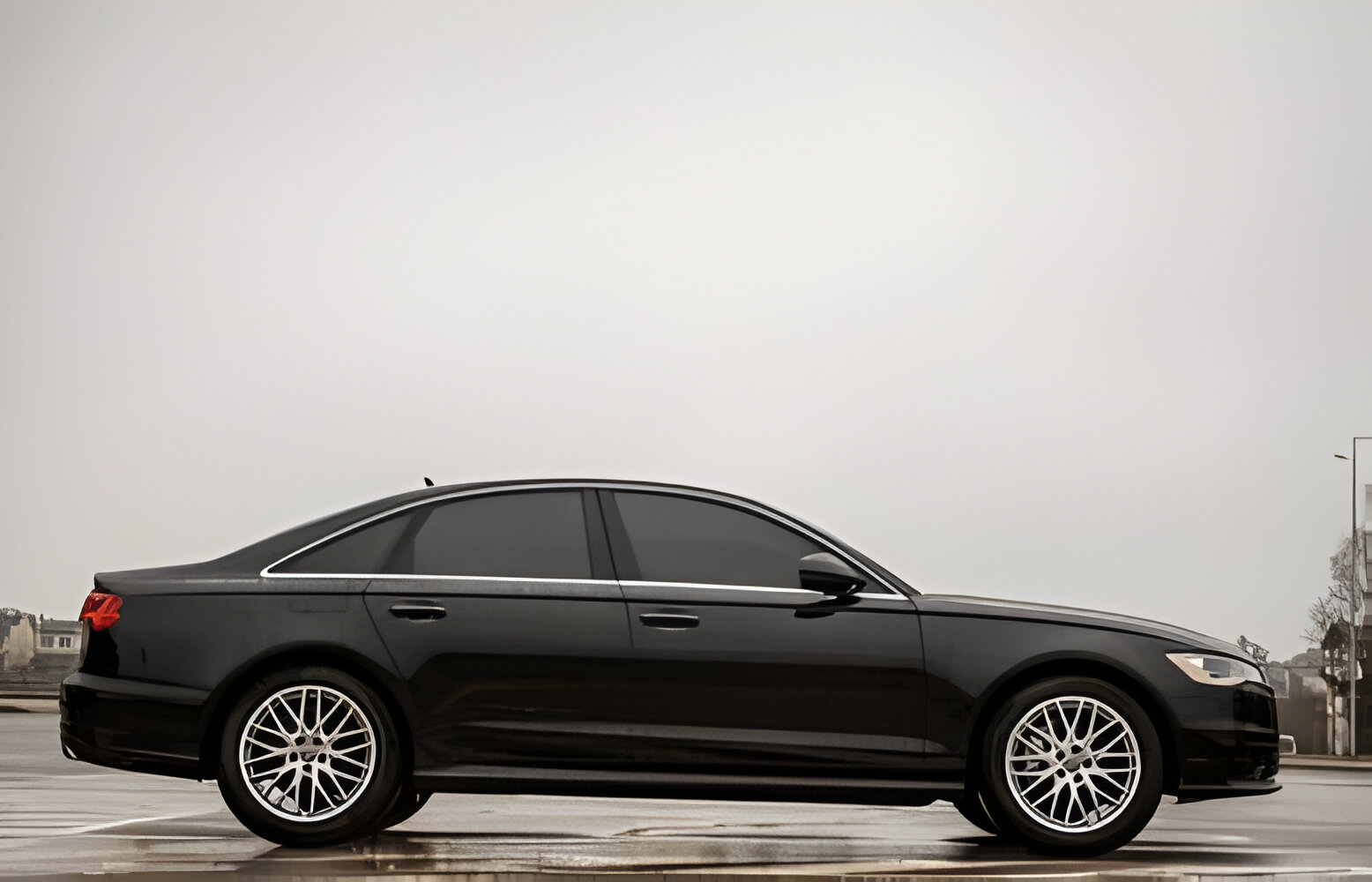 Black new modern business car is parked on the road