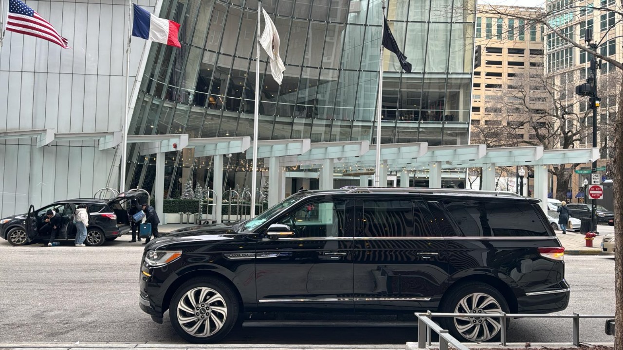 Black SUV stands in front of a building