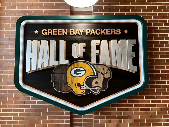 The entrance sign for the Green Bay Packers Hall of Fame at the Lambeau Field atrium.