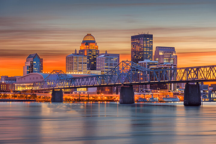 Louisville, Kentucky, USA downtown skyline at the river at dusk.