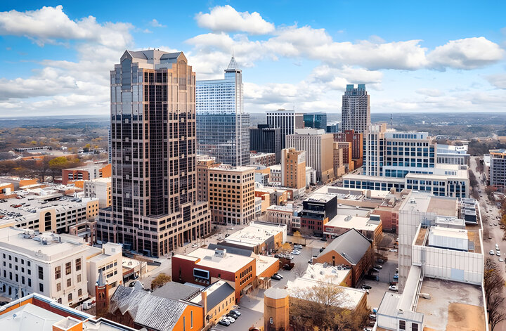 Aerial view of Raleigh, North Carolina skyline on a sunny day.