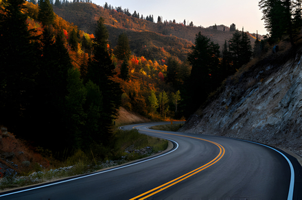 A Mountain Road Winding Through a Colorful Autumn Morning in Alpine Utah