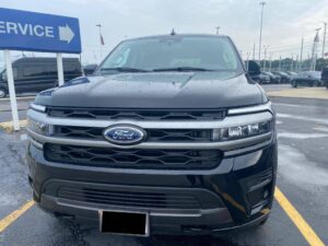 Luxury Black Ford Expedition on road