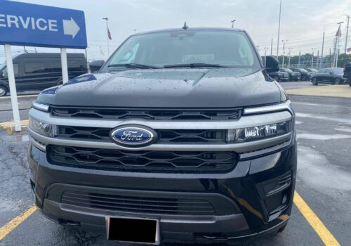 Luxury Black Ford Expedition on road