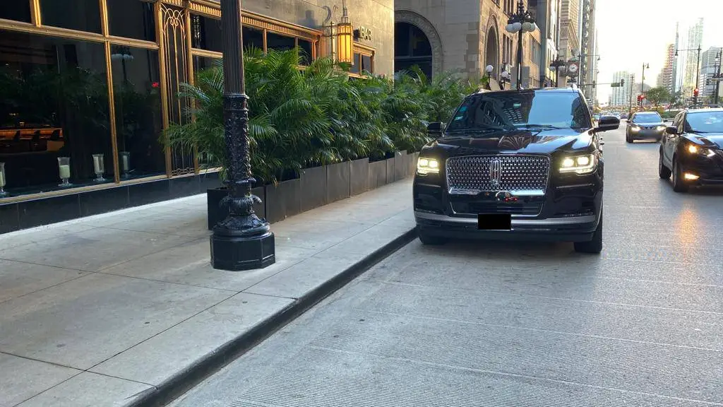 Black Lincoln Navigator Standing on a side of road