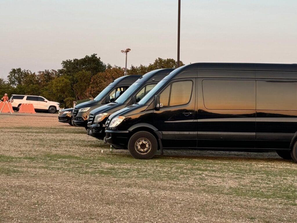 Luxury black sprinters parked in a single line